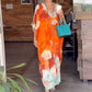 Lockeres langes Kleid mit Blumenmuster und halben Ärmeln