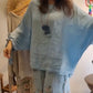 Damen-Set aus locker geschnittener Bluse und Hose mit weitem Bein und Blumenmuster